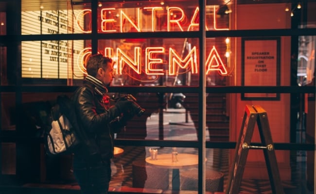 Man clicking the photo outside the Central Cinema